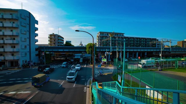 A timelapse of downtown street at Kanpachi avenue in Tokyo daytime wide shot tilt