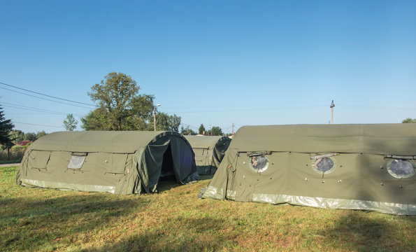 large, green, military canvas tents