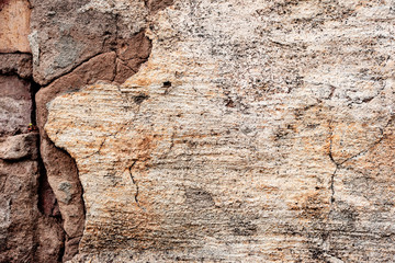 Texture of a concrete wall with cracks and scratches which can be used as a background