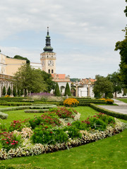 flowering garden near Mikulov Castle, grassy area, threshing paths, clock tower