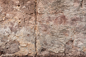 Texture of a concrete wall with cracks and scratches which can be used as a background