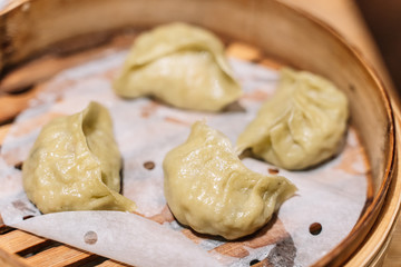 Obraz na płótnie Canvas Close up fresh boiled dumplings with hot steams