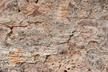 Texture of a concrete wall with cracks and scratches which can be used as a background