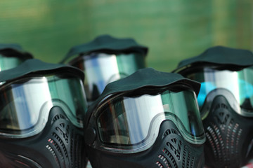 Closeup of paintball game battle full face protective masks