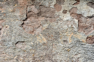 Texture of a concrete wall with cracks and scratches which can be used as a background