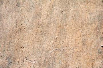 Texture of a concrete wall with cracks and scratches which can be used as a background