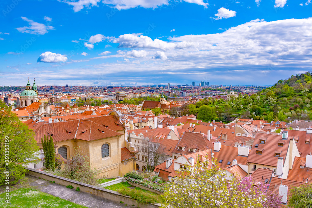 Wall mural panorama of prague with traditional red roofs in springtime, czech republic