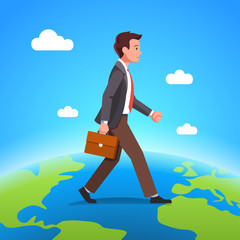 Business man walking over globe or earth planet