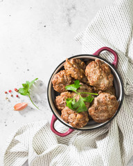 Homemade meatballs in a ceramic bowl