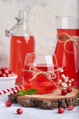 Healthy cranberry juice drink and fresh cranberries. Traditional Russian beverage mors © natkinzu