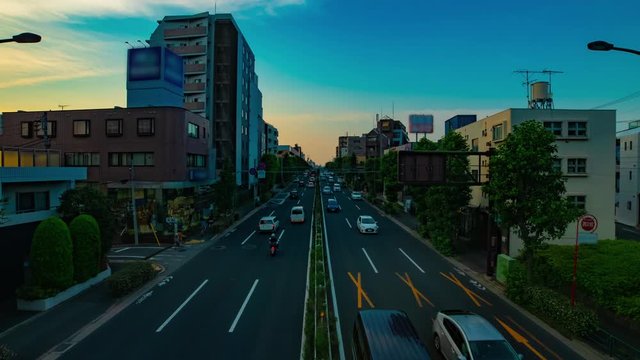 A timelapse of downtown street at Kanpachi avenue in Tokyo daytime wide shot zoom