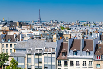 Paris, typical buildings and roofs in the Marais, aerial view from the Pompidou Center, with the Eiffel Tower in background