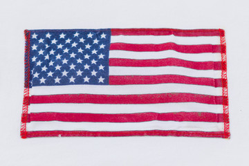 USA flag on a white background. American flag on white cloth. Symbol of independence
