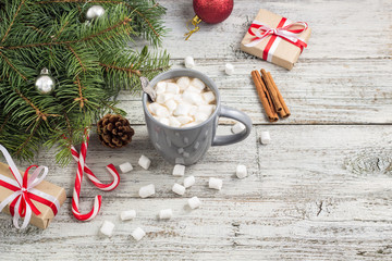 Winter hot drink. Christmas hot chocolate or cocoa with marshmallow on white with christmas decorations