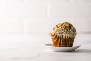 Homemade pistachio muffins with sugar crystals