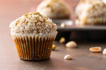 Homemade pistachio muffins with sugar crystals