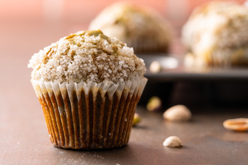 Homemade pistachio muffins with sugar crystals