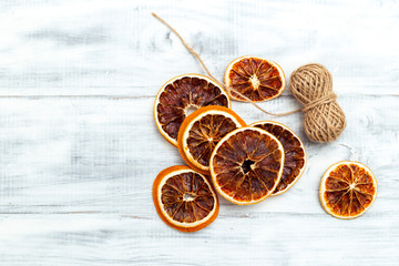 Dried Orange Slices For Christmas Orange Slice Garland on white wooden background. Copy space