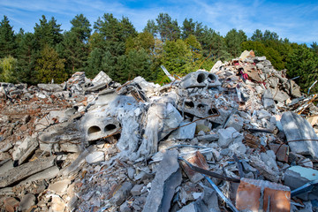 Pile of debris at the demolition of commercial buildings in the city. Place of construction works in Central Europe.