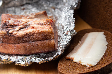 Lard with black bread and a piece of lard in foil