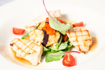 salad with grilled chicken breast and vegetables