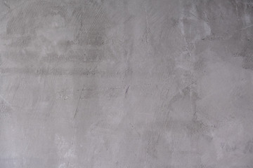 Abstract gray background. Rough concrete wall covered with cement