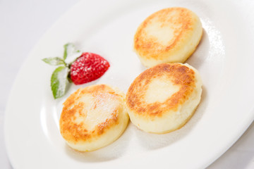 cottage cheese cheesecakes on a white plate