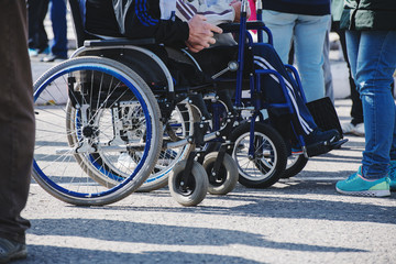 wheelchair wheels closeup on asphalt