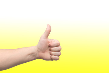 Closeup of male hand showing thumbs up sign