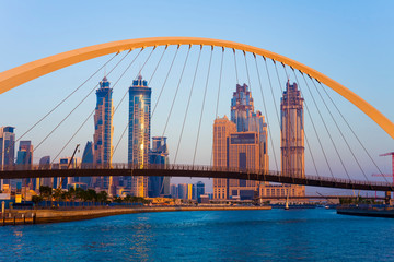 Dubai city skyline at sunset. view of Tolerance bridge