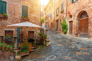 Fototapeta na wymiar Beautiful alley in Tuscany, Old town, Italy