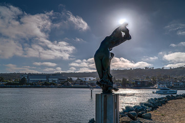 Mermaid sculpture presiding over San Diego Bay on Shelter Island, San Diego.  August 29, 2019