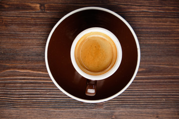 Cappuccino on a brown wooden background. Menu