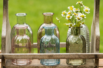 Little bottles in a wooden tray