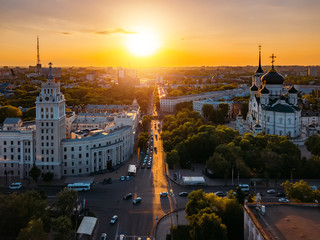Fototapeta premium Evening summer Voronezh cityscape. Tower of management of south-east railway and Annunciation Cathedral at sunset