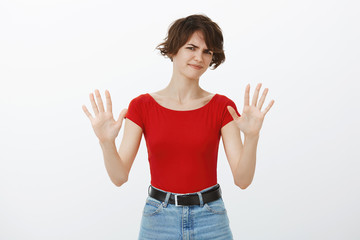No enough lets end conversation. Displeased annoyed young woman refuse clingy man hold hands block...
