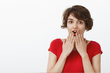 Close-up surprised impressed attractive enthusiastic woman short pixie haircut gasping drop jaw...