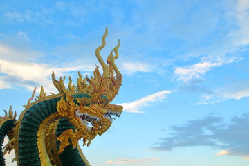 Fototapeta na wymiar golden dragon on blue sky