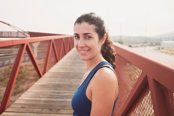 Pretty mid adult woman ready for training running exercises