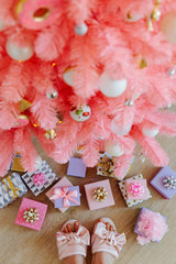 Pink Christmas tree and christmas decorations white and gold color.  Christmas background. Happy New Year and Xmas Christmas concept. .
