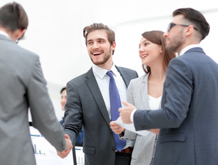 Fototapeta premium Business people shaking hands, finishing up a meeting