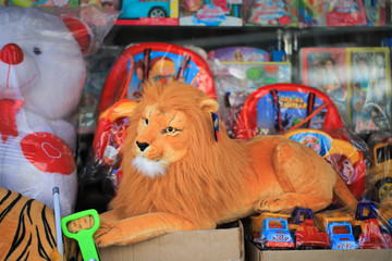 Naklejka premium Plush leon toy in the market