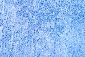 Rough texture of abstract decorative dark blue background of plaster wall.