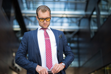 Businessman adjusting belt