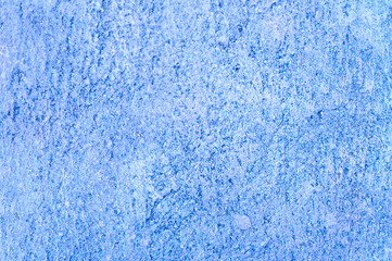Rough texture of abstract decorative dark blue background of plaster wall.