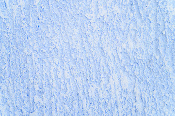 Rough texture of abstract decorative light blue background of plaster wall.