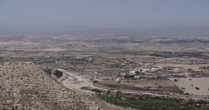 Establishing long shot of a valley near the town of Mojacar in Andalusia, Spain by summer.