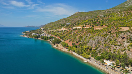 Aerial drone photo of famous seaside area and main town of Loutraki with sandy organised beach with turquoise clear sea and resorts, Greece