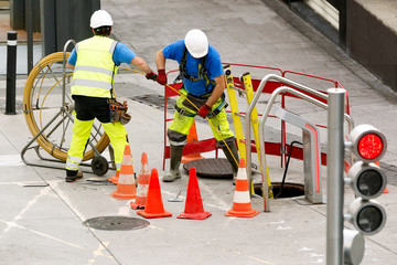 electrician workers of service company to repair traffic lights in city street