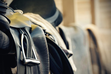 Black sports saddle. Horse ammunition.